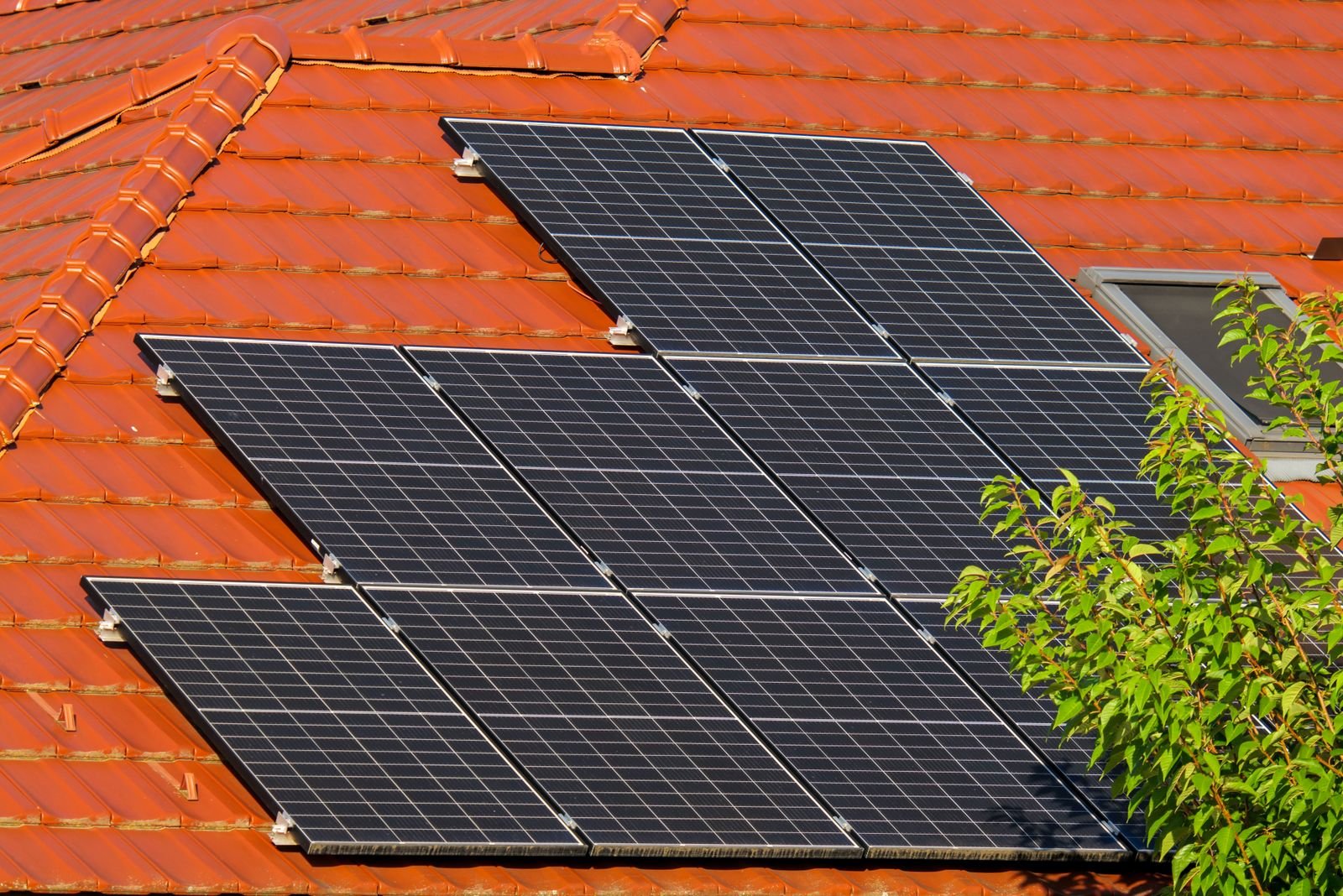 Solar panels installed on a traditional sloped tile roof